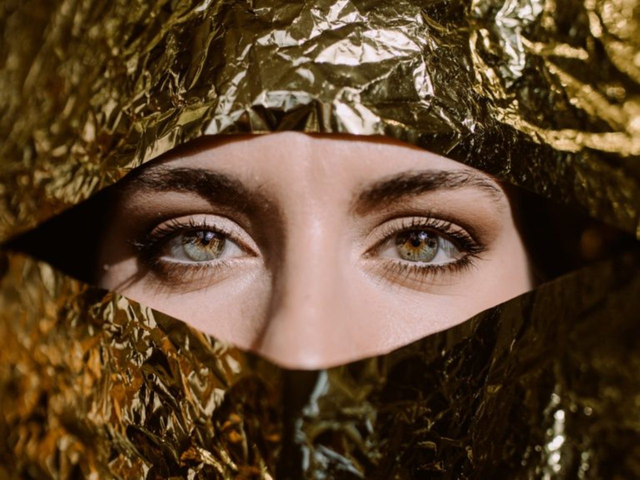 woman-behind-gold-paper-2388647